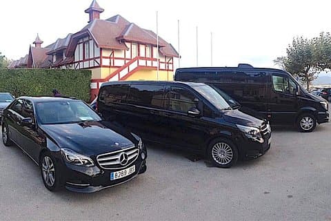 In a luxury Mercedes Benz (car, minivan, 8PAX-van)