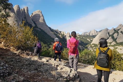 Hiking a trail in the Natural Park of Montserrat.