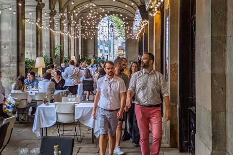 Walking under the arches of the first of two buildings to be photographed in Spain in 1839