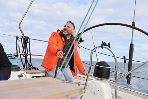 Learning to take the helm of the boat