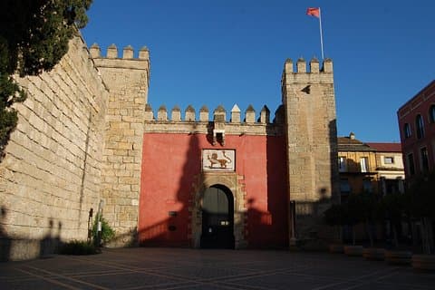 The Lion's Gate, the main entrance to the Real Alcázar of Seville, a palatial architectural complex with a thousand years of history, stands as one of the city's most beautiful landmarks.