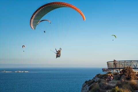 Paragliding flight through Santa Pola Lighthouse