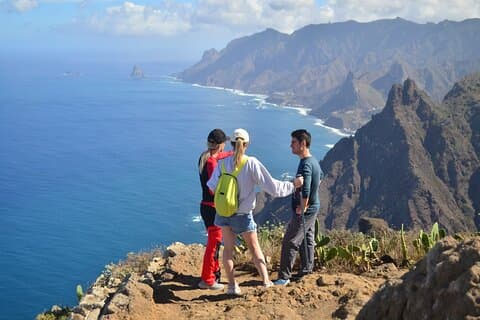 Dramatic ocean cliffs of northern Tenerife near Roque de Taborno, surrounded by lush Anaga landscapes.