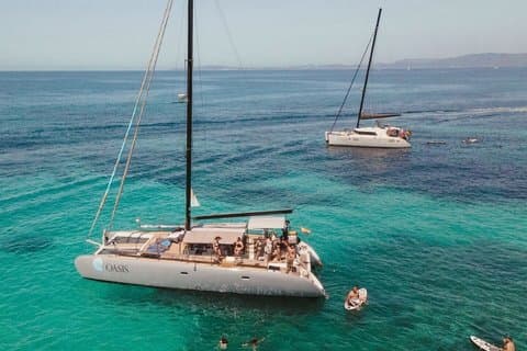 Catamaran sailing in Mallorca through the Bay of Palma with BBQ