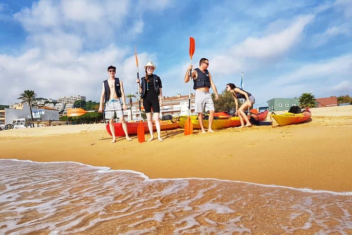 Getting ready for the sea kayaking experience on the beach in the Costa Brava.