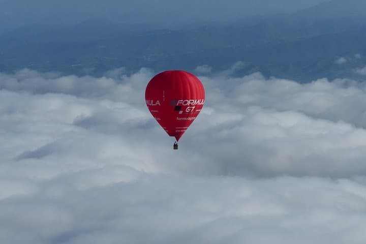 Over the clouds with a hot-air balloon