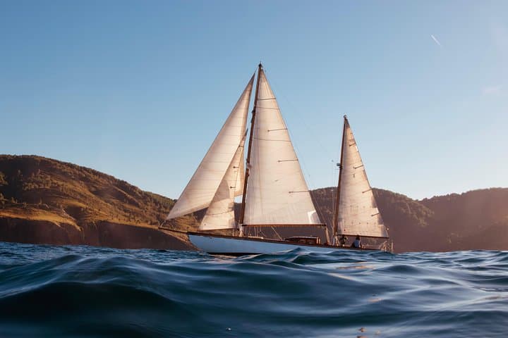 Sail discovering the coast aboard a classic sailboat