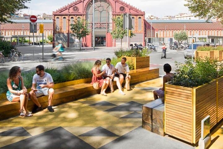 People enjoying the superblock next to the sant antoni market