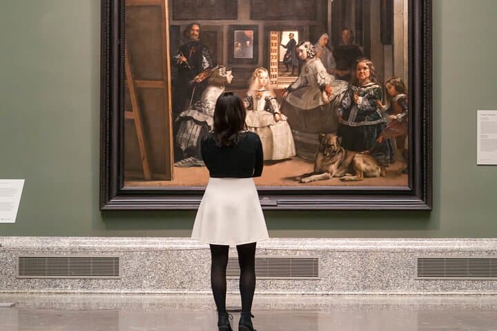 Woman looking at Velazquez's masterpiece, Las Meninas
