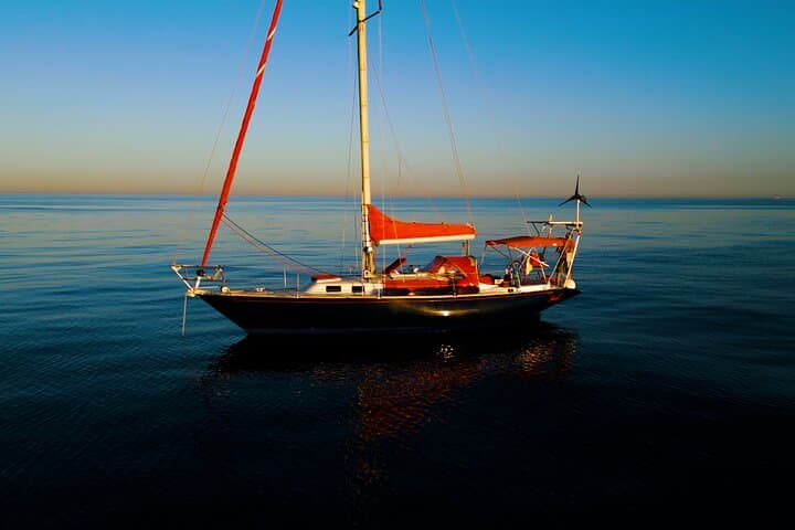 The Red Sailboat calm sea