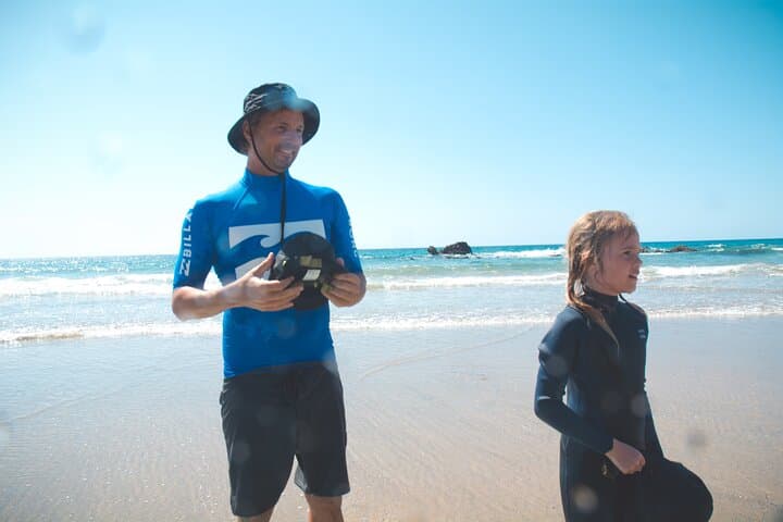 Children under 10 get a surf helmet with a soft neoprene cover. The helmet protects against the sun and possible impacts from the surfboard.