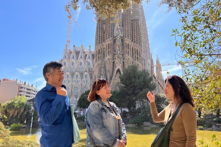 Visitors in front of Sagrada Familia's passion facade