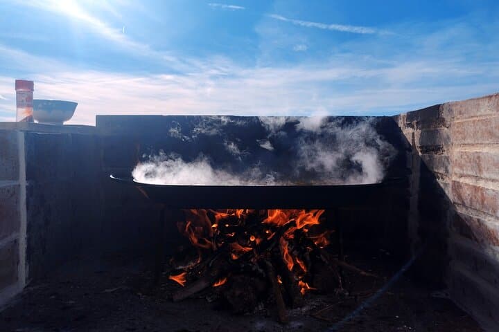 Traditional Valencian paella, cooked with orange wood.