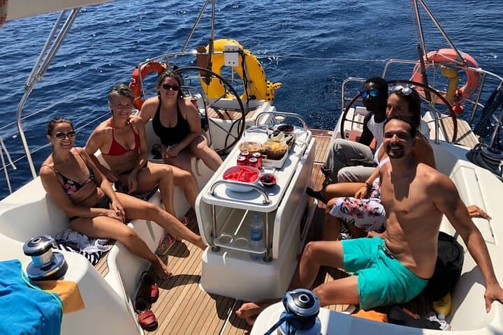 Barcelona Day & Sunset Sailing: Open Bar, Local Tapas & Swim