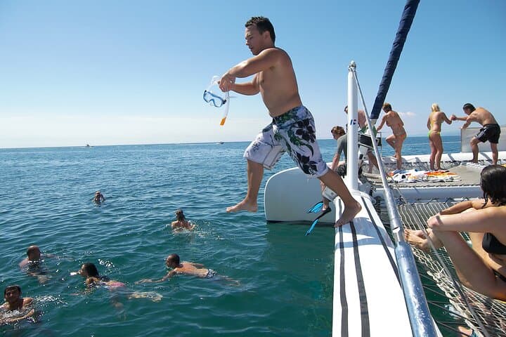 Catamaran cruise with drinks, food and swimming stop