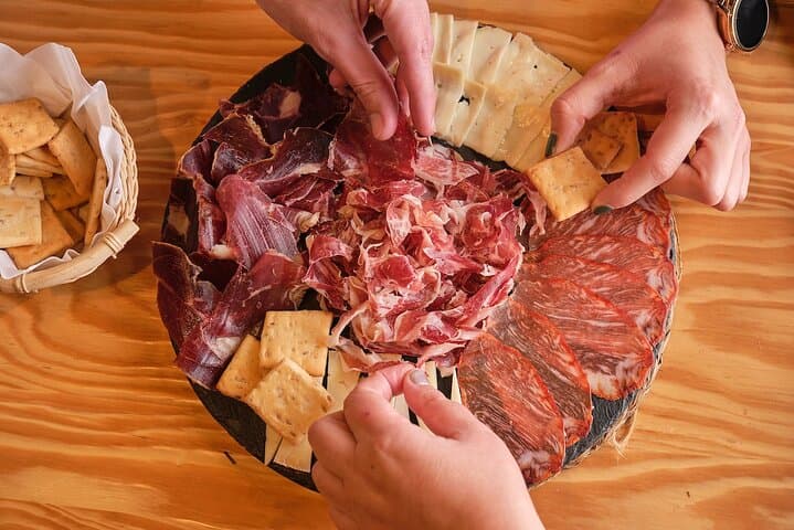 Start the evening with the crown jewel of Spanish food a hole-in-the-wall charcuterie shop as you meet the owner and try some of the most celebrated products in Spain!