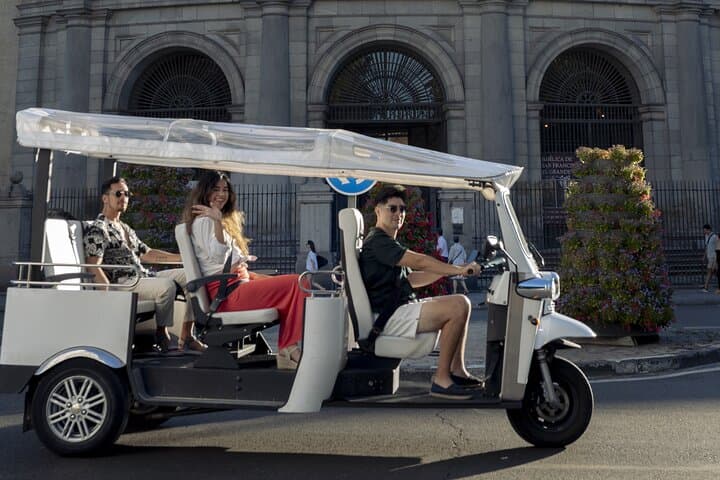 "Madrid: Panoramic views in Tuk Tuk with pickup available"
