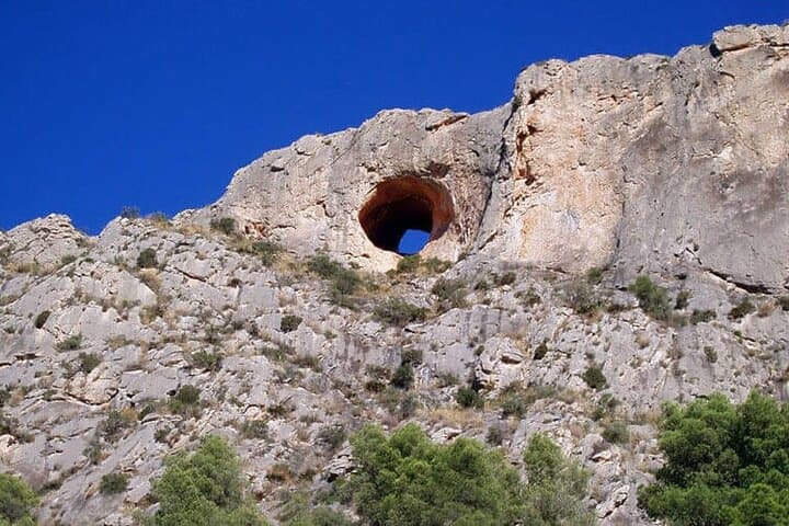 Stunning views of Mount Goldenhead and its famous natural 'eye' from the cave entrance