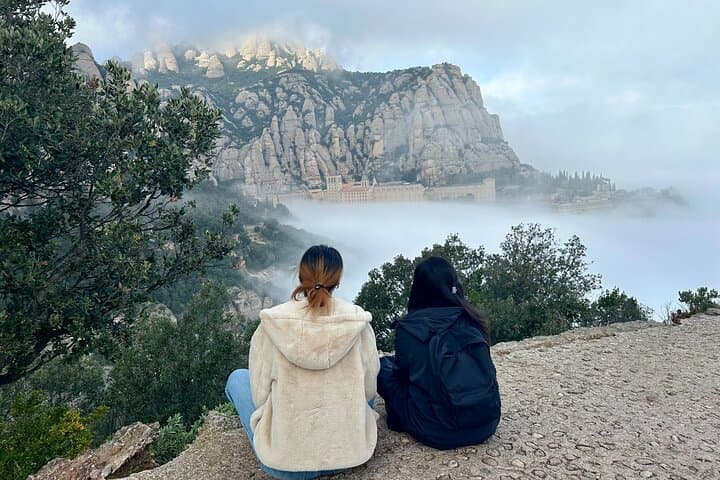 Two visitors enjoying the views of the mountain