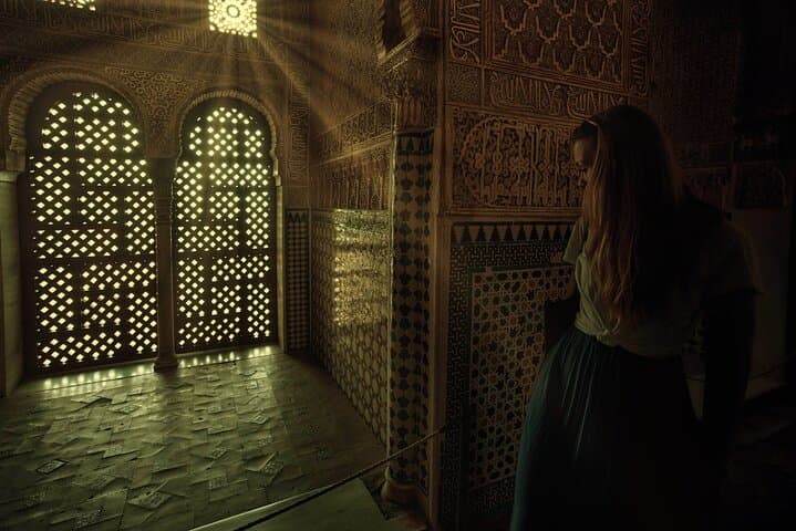 Visitor admiring intricate arches
Marvel at Alhambra’s ornate arches, masterpieces of Islamic art crafted with unmatched precision and elegance.