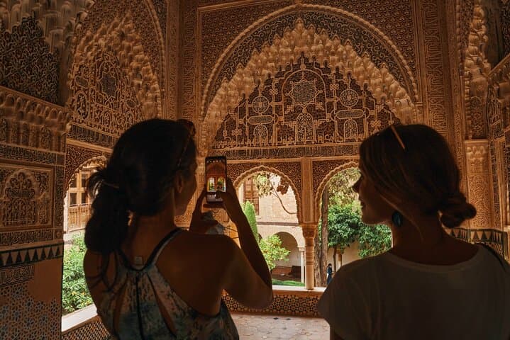Visitors silhouetted in hall
Experience Alhambra’s magic in golden light, where every hall invites reflection and awe-inspiring discovery.