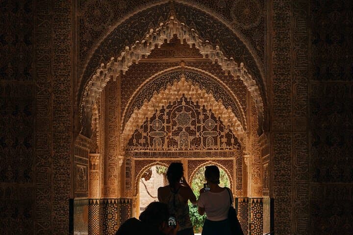 Women exploring ornate arches
Walk beneath Alhambra’s ornate ceilings—every detail a testament to Moorish craftsmanship and imagination.