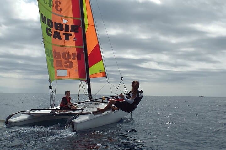 Hanging in trapeze in hobie cat 15