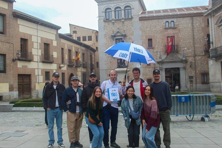 Small group in the historical Plaza de la Villa.