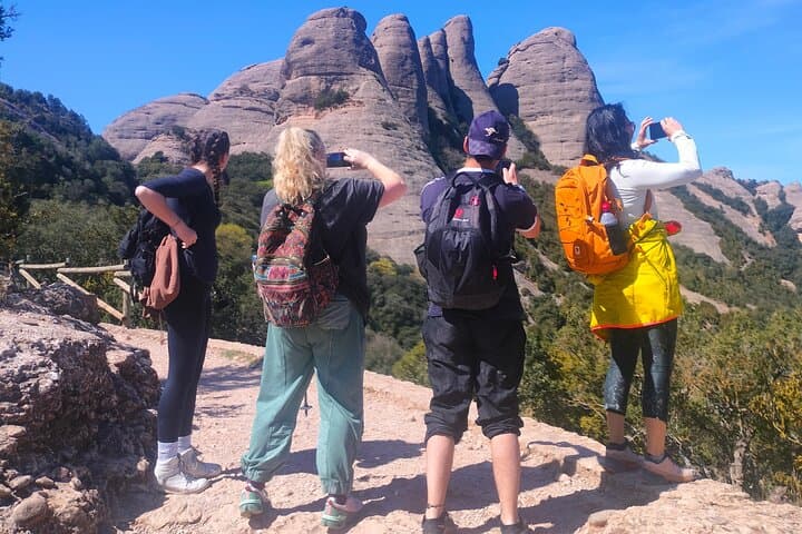a group admiring the views of Montserrat Mountain