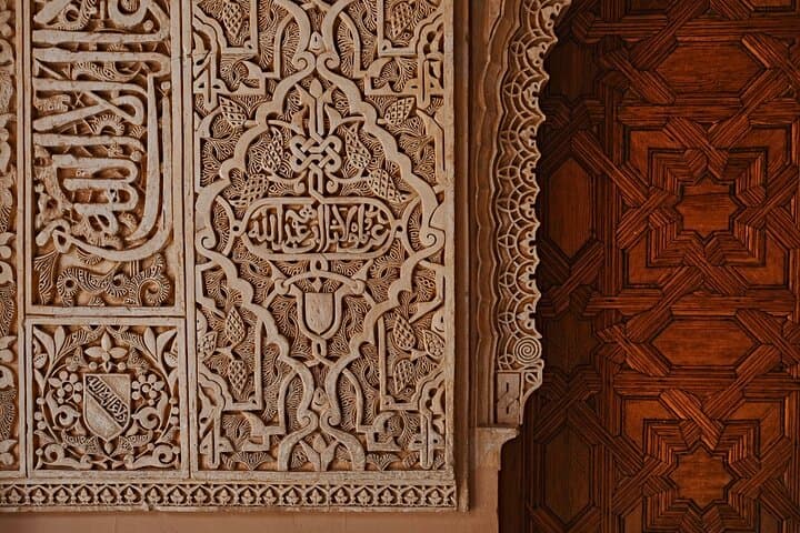Capture breathtaking views of Granada from the Alhambra fortress while enjoying a historical tour with a local expert.