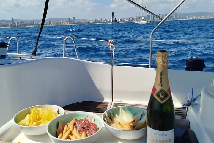 Barcelona Badalona Sailboat Tour Snack Drinks Swimming Sunset