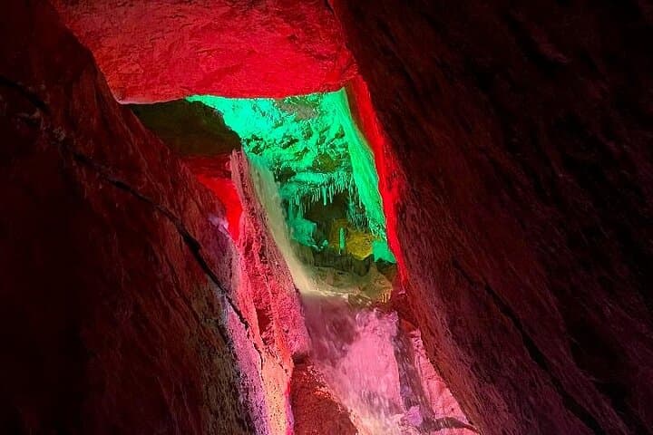 Experience the magical light show in a stunning cave, a hidden gem on Ibiza.