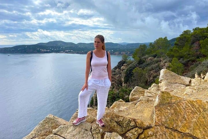 Standing on the edge of the island´s rugged coastline, overlooking the vast sea and majestic mountains.