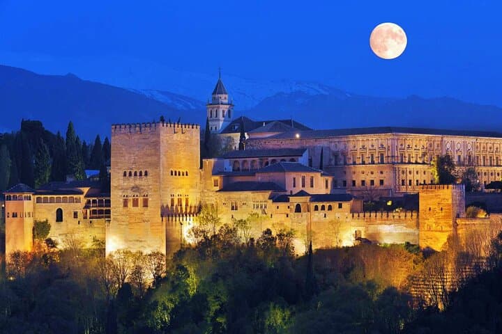 Panoramic view of the Alhambra from the Mirador de San Nicolás at sunset
