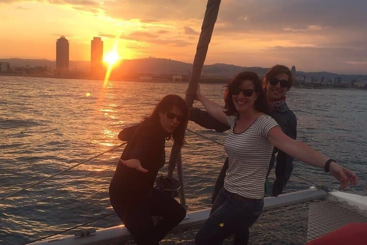 Fun sunset between friends and travelers in Barcelona