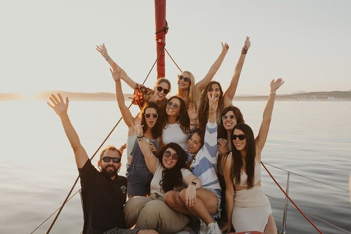 Group of Friends renting sunset on sailboat in Sotogrande