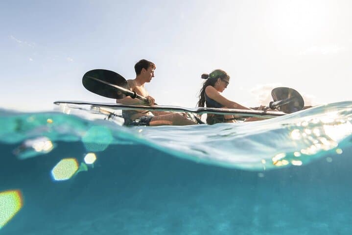 Guided tour in transparent kayaks of Addaia Bay