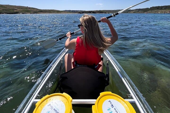 Guided tour in transparent kayaks of Addaia Bay