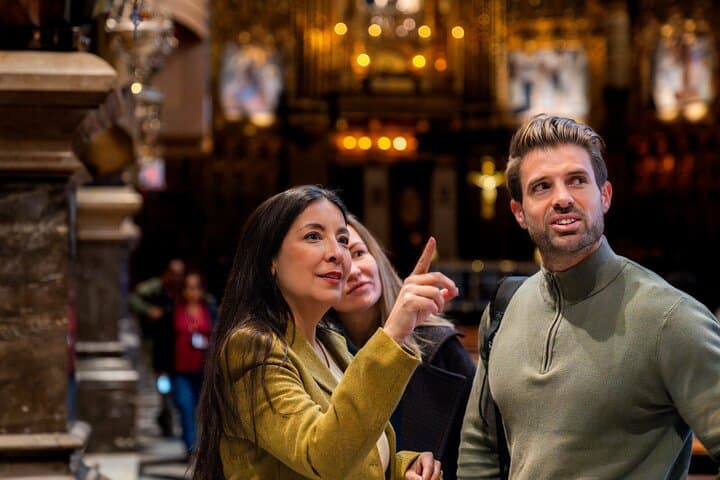 Visitors admire the ornate interior of Montserrat Basilica during a guided tour — a highlight of any cultural day trip from Barcelona