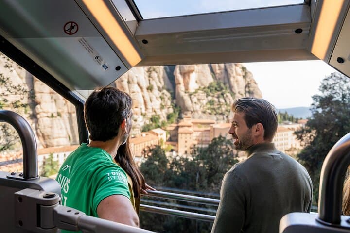 Guests enjoy panoramic views of Montserrat Monastery and the surrounding mountains while ascending on the Sant Joan Funicular, the steepest railway in Spain