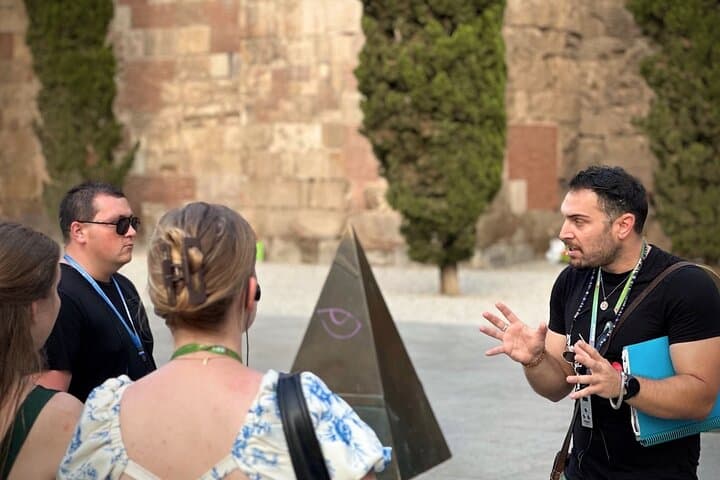 Tour guide explaining local history on private tour of Barcelona