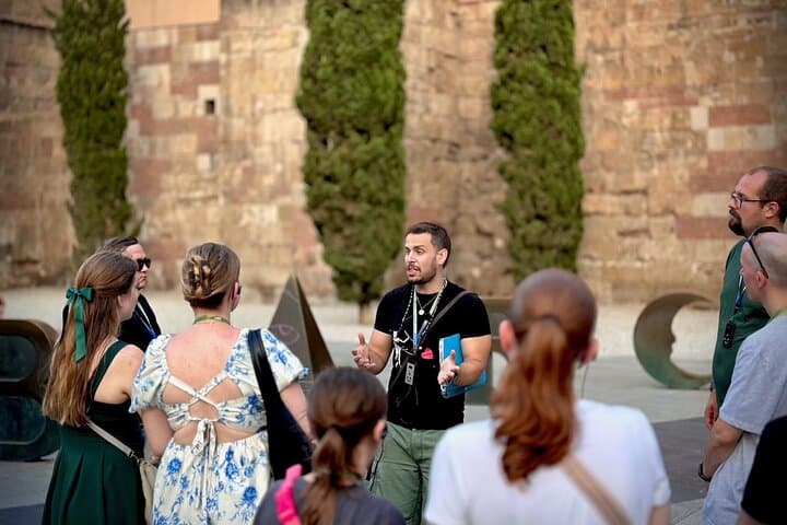 Tour Guide explaining the history of the Spanish Civil War in Barcelona to a group of guests