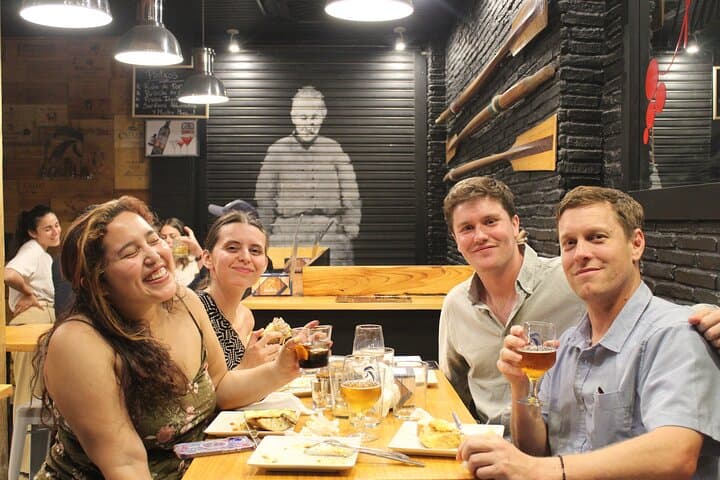 Guests smile an+d relax after enjoying some pinchos at the final stop.
