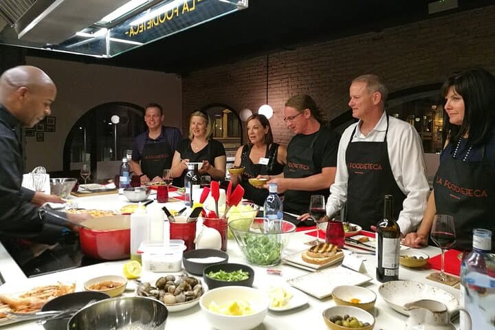 Rolling up sleeves and cooking authentic Spanish tapas with our chefs.