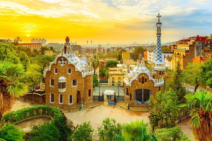 Magical sunrise over Park Güell, with Gaudí’s fairytale houses and sweeping views of Barcelona.