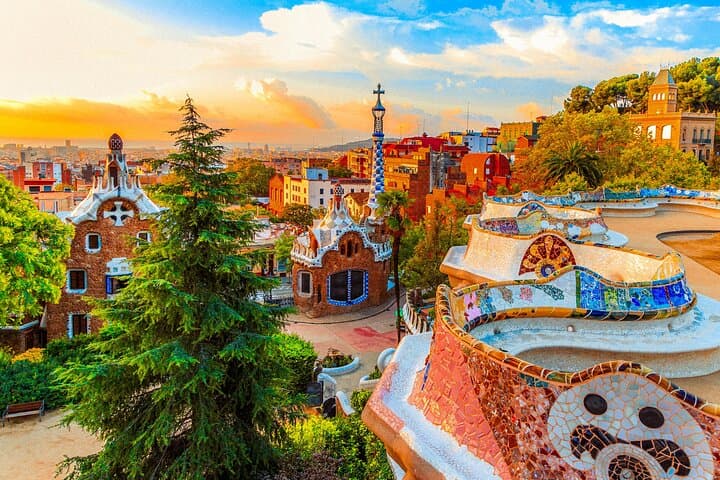 Colorful mosaic benches and gingerbread-style houses make Park Güell one of Gaudí’s most iconic works.