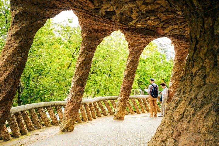 Walk beneath Gaudí’s stone colonnades in Park Güell, where architecture and nature blend seamlessly.