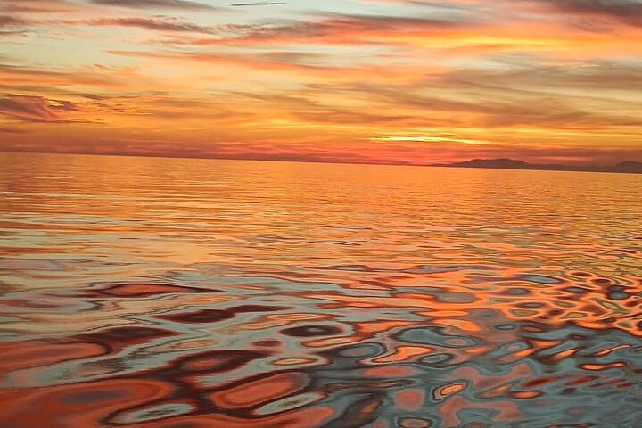 Sunset sailing along the cliffs of Maro- Private