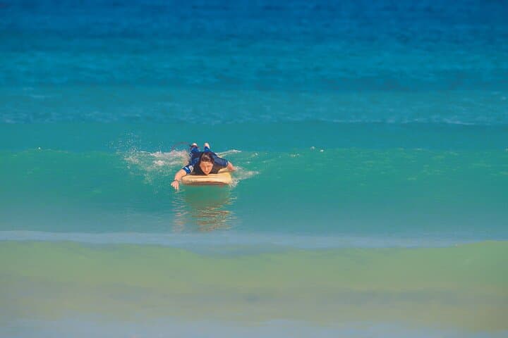 Perfect timing and right position to paddle into an unbroken green wave.