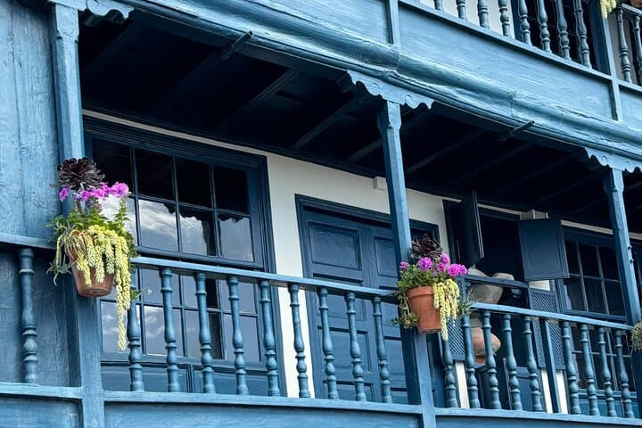 Traditional La Palma houses with wooden balconies overlooking the ocean - similar to the building where we run our tastings